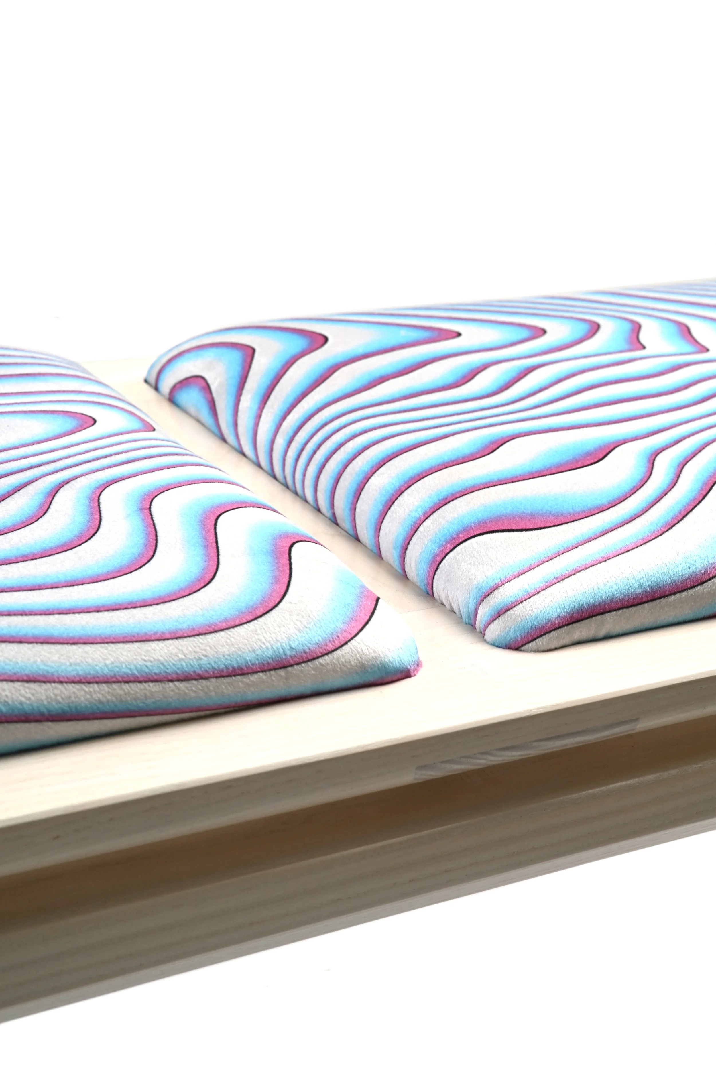 Custom pattern of the cushions realized with textile designer Lærke Lillelund. Inspired by wood pattern with Miami colors