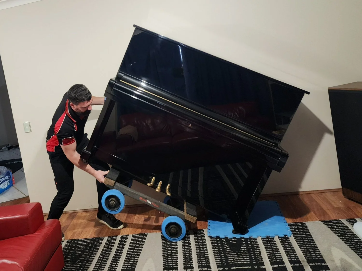 Careful piano handling with specialised equipment
