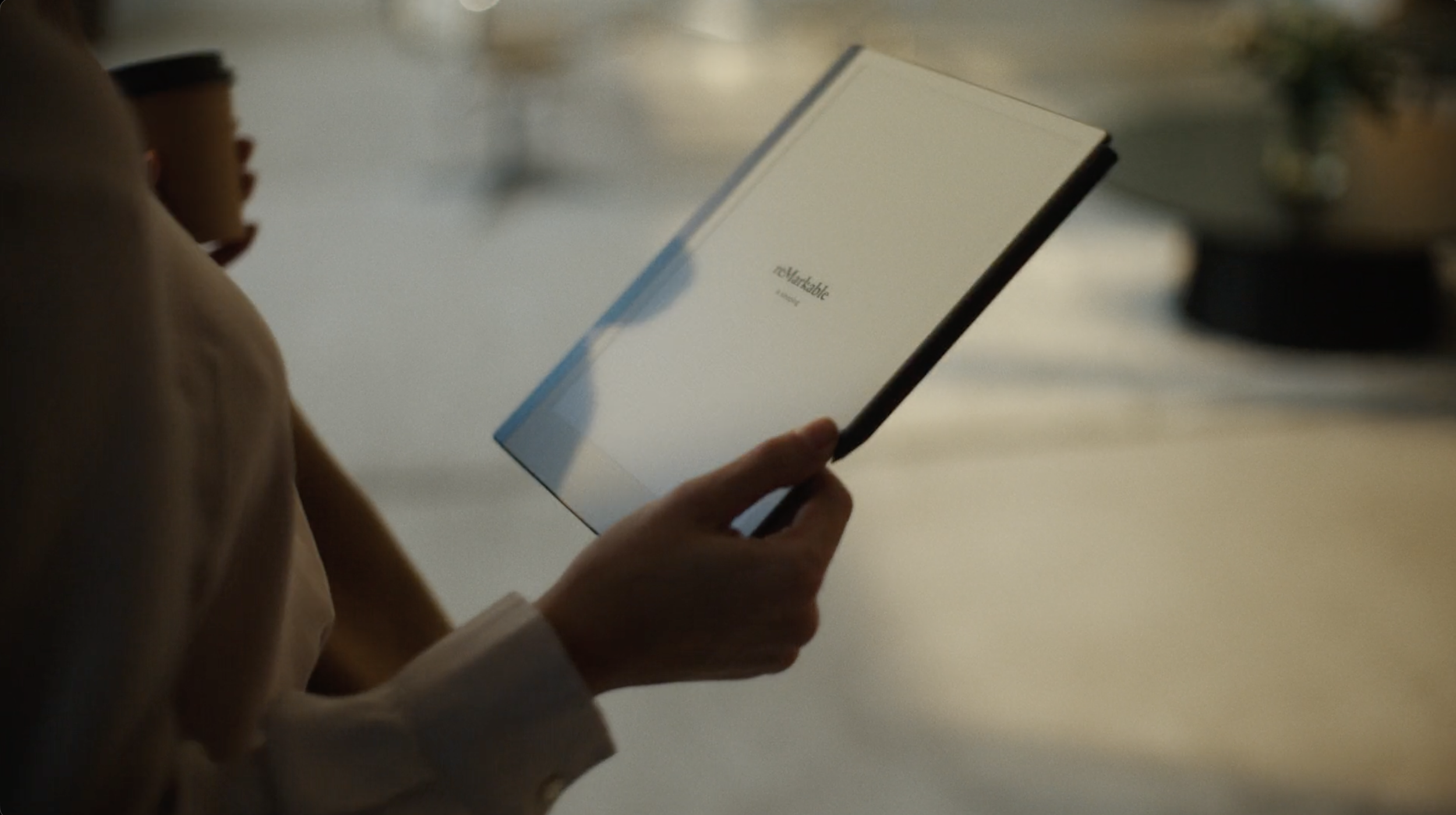 Person holding a reMarkable tablet in a commercial still, cinematography by Johan-Fredrik Bødtker.
