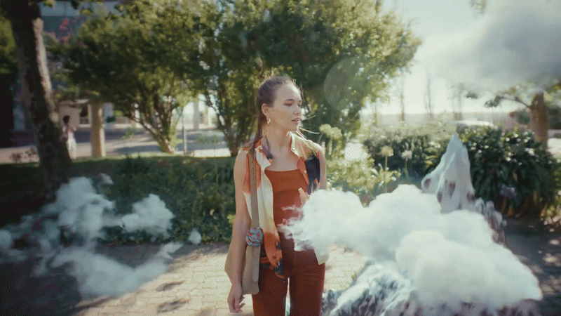 Woman walking through a surreal mountain landscape in a Burt’s Bees campaign, cinematography by Johan-Fredrik Bødtker.