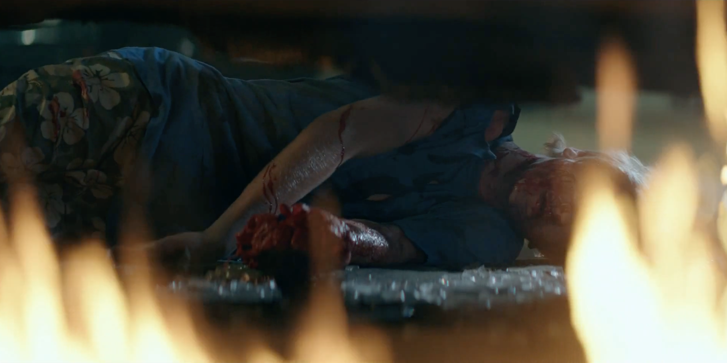 Man lit by practical lights in a dark scene from Occupied, cinematography by Johan-Fredrik Bødtker.