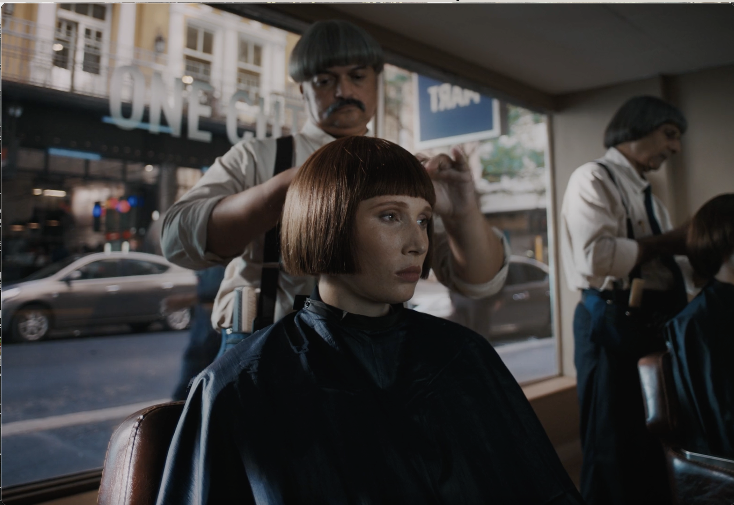 Woman getting a haircut in a salon in a still from the CBOE commercial, cinematography by Johan-Fredrik Bødtker.