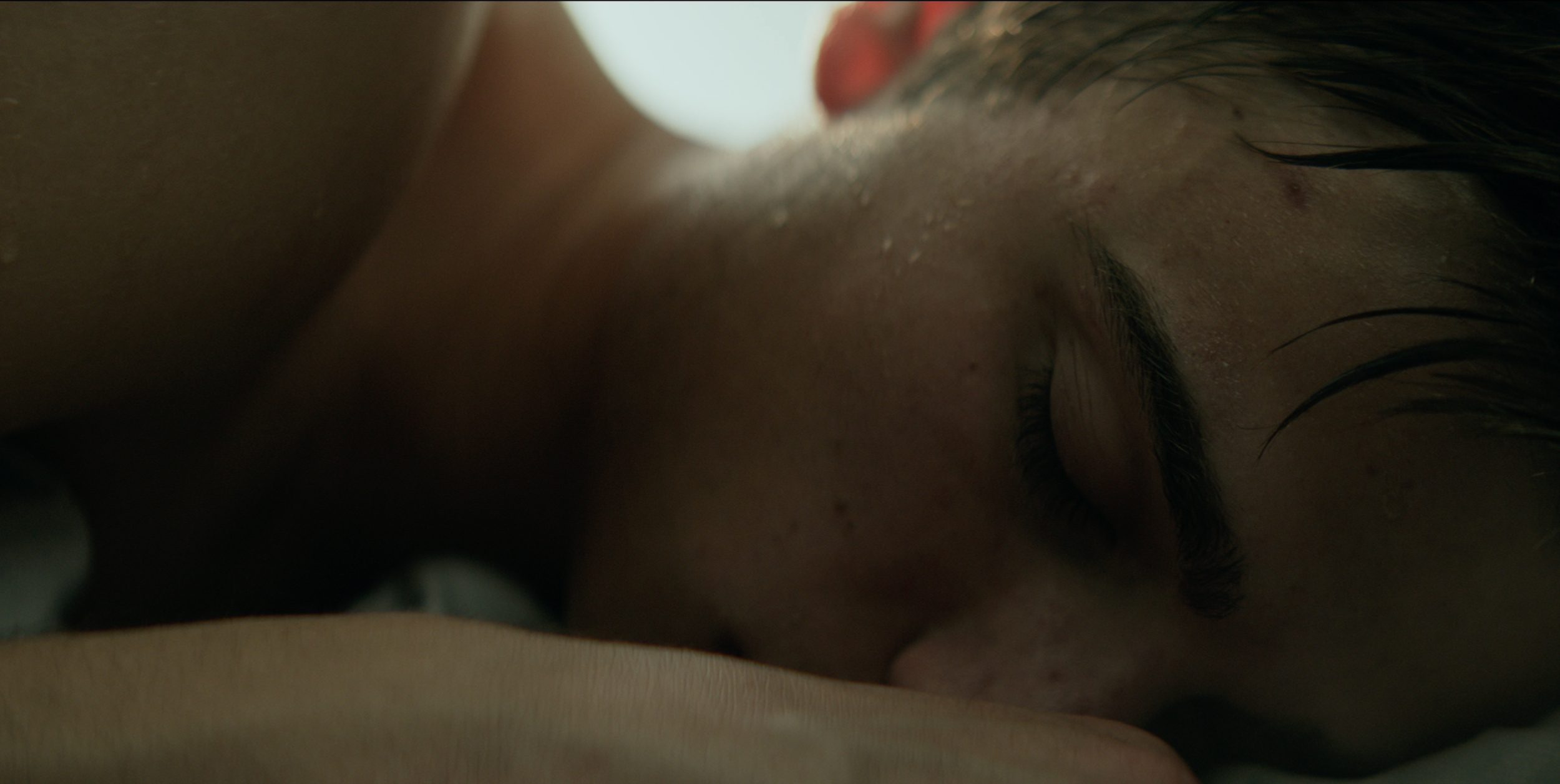 Close-up of a person sleeping in a scene from Occupied, cinematography by Johan-Fredrik Bødtker.