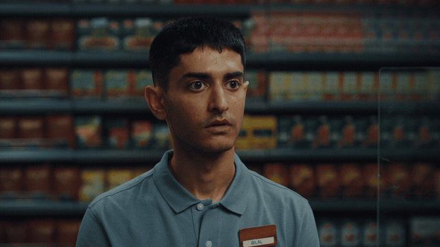 Man standing inside a convenience store in a Vend / Blokket commercial, cinematography by Johan-Fredrik Bødtker.