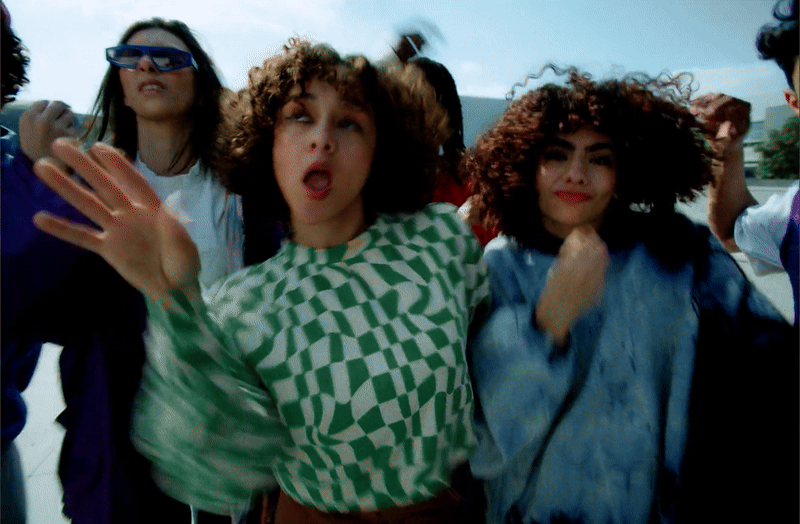Group of young people outdoors in a KFC commercial still, cinematography by Johan-Fredrik Bødtker.