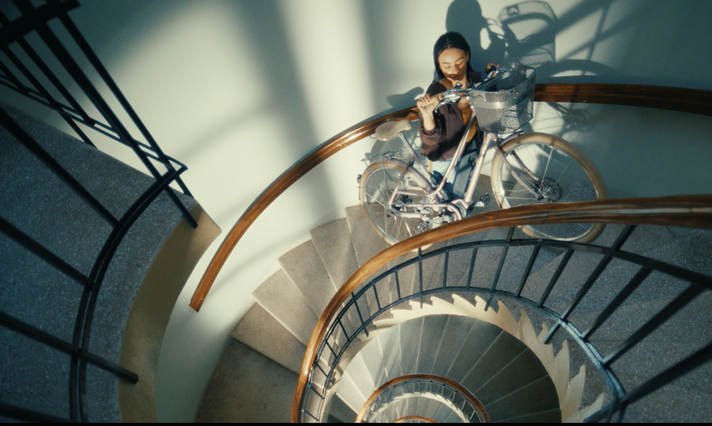 erson standing on a spiral staircase in a Telenor Sikre commercial, cinematography by Johan-Fredrik Bødtker.