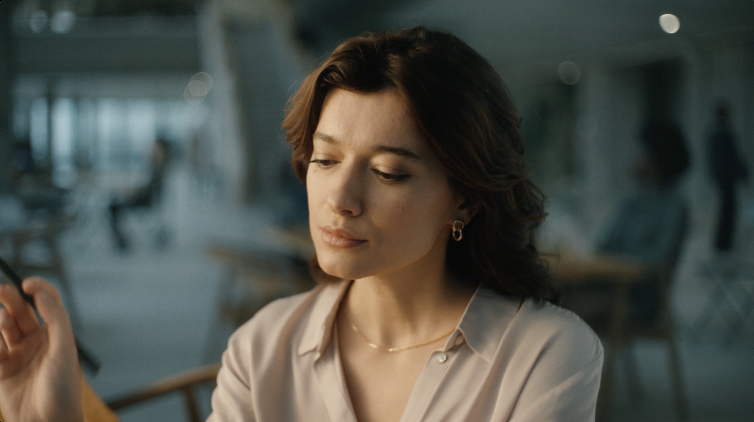 Woman using a reMarkable tablet in a modern office in a commercial still, cinematography by Johan-Fredrik Bødtker.
