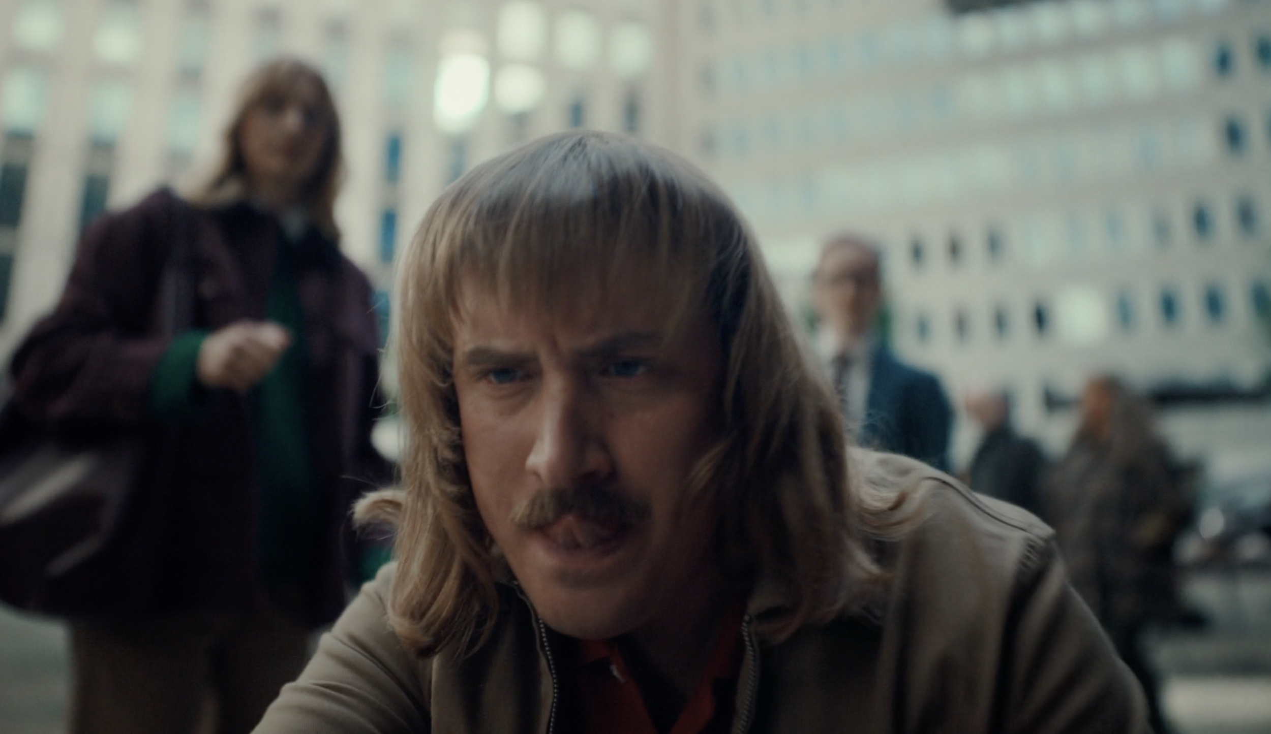 Close-up of a man with a moustache in a Vend / Blokket commercial, cinematography by Johan-Fredrik Bødtker.
