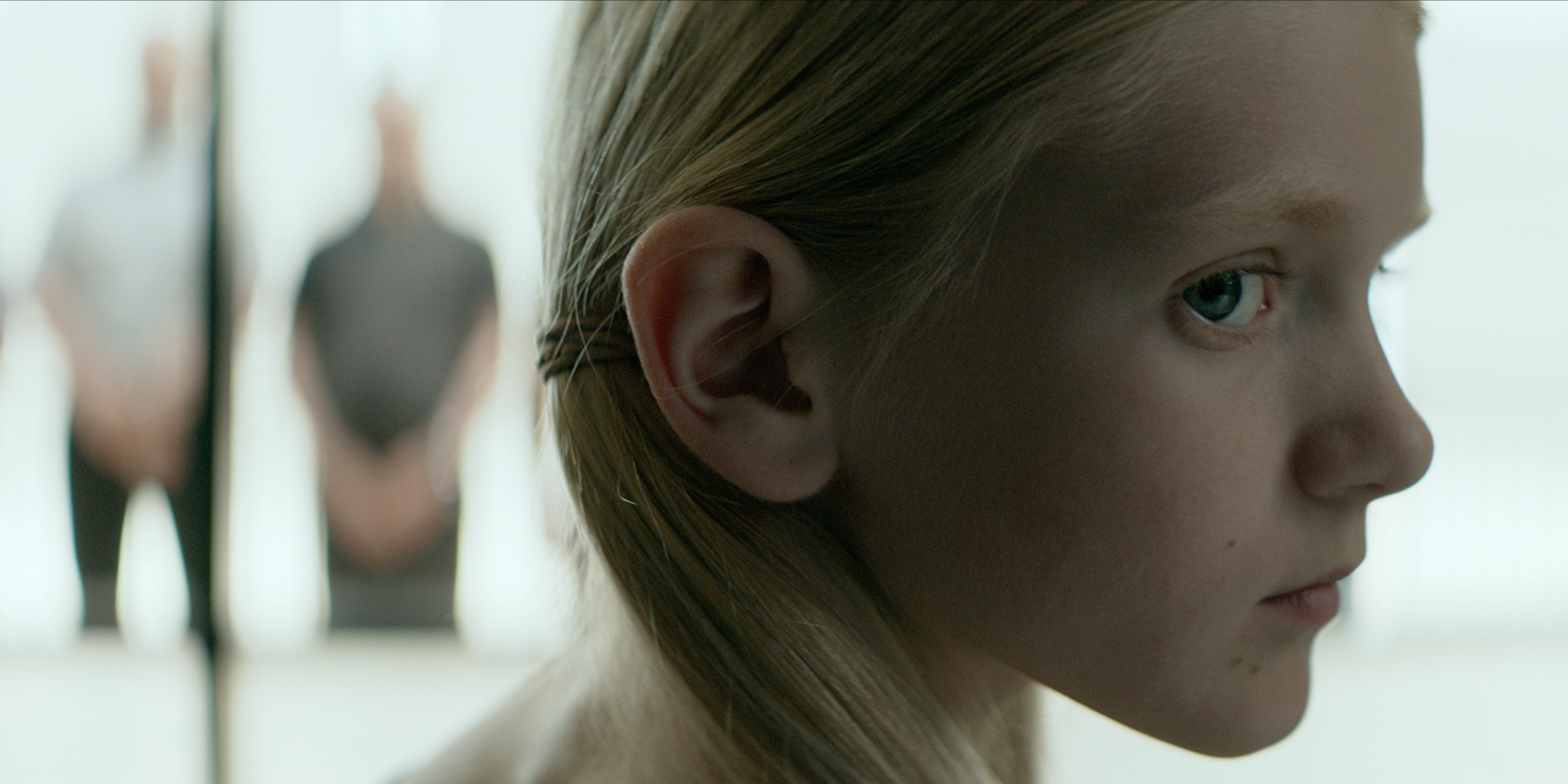 Close-up of a young blonde girl in Occupied, cinematography by Johan-Fredrik Bødtker.