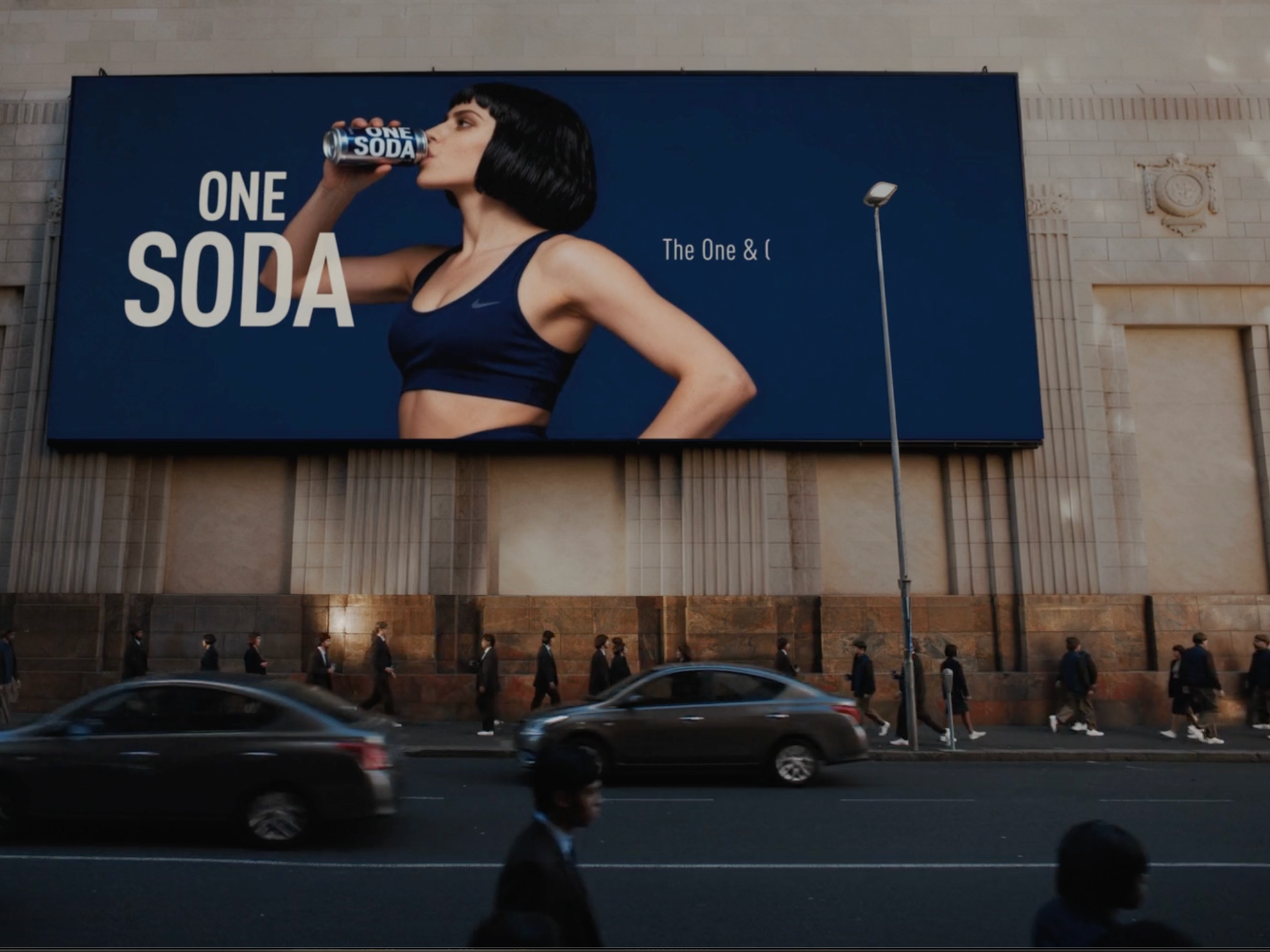Woman standing beside a large billboard in a commercial still from CBOE, cinematography by Johan-Fredrik Bødtker.