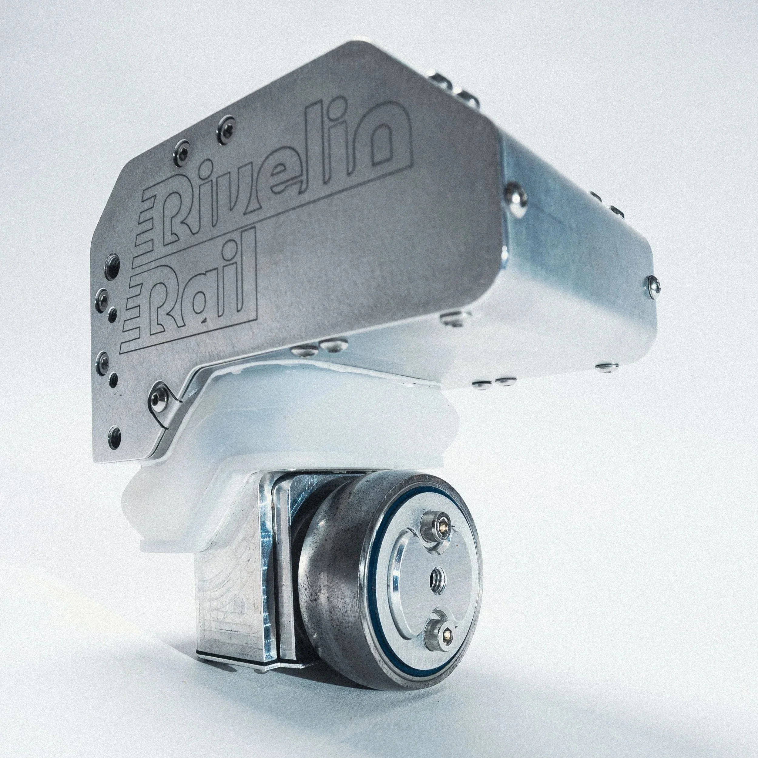 Close-up of a Rivelin Rail MRT∞ measurement head with engraved text, set against a plain background.