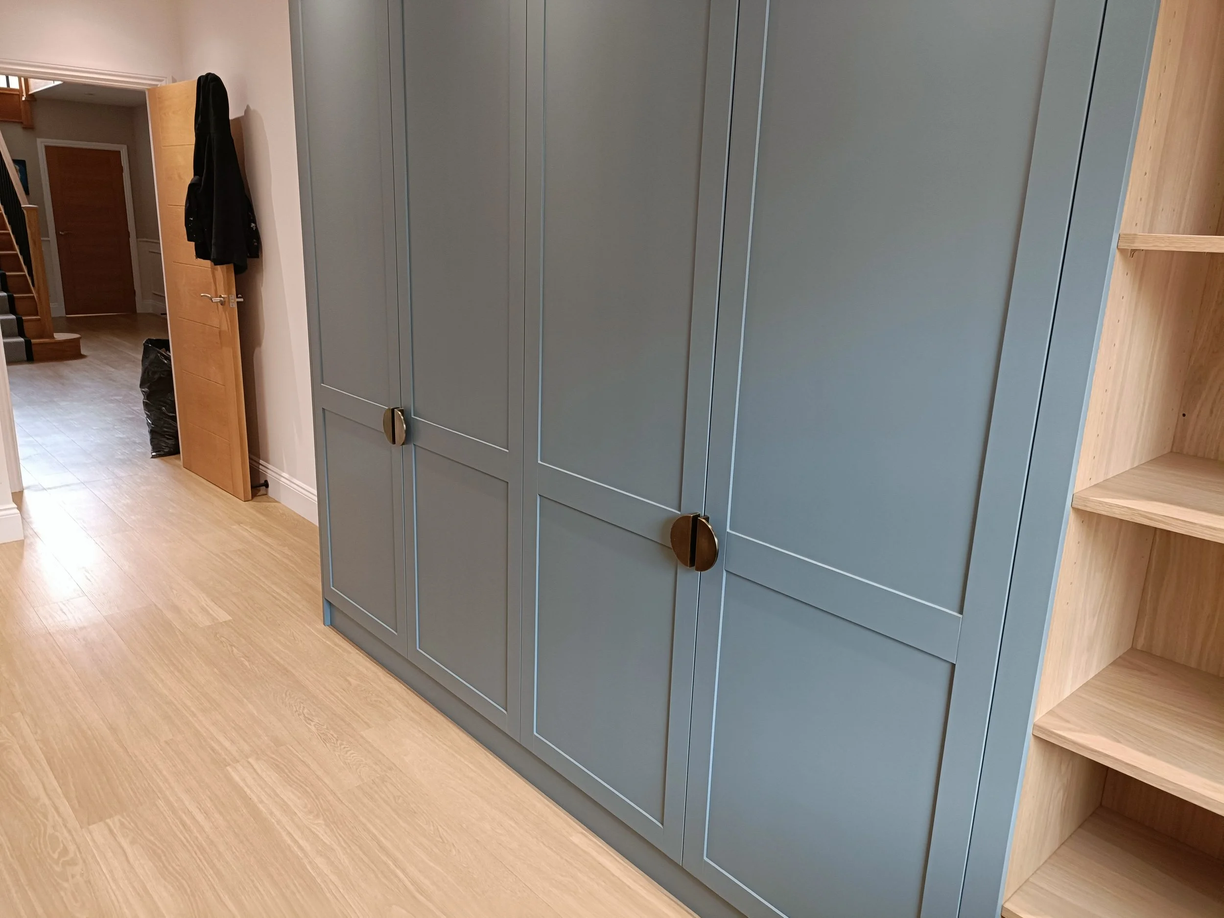 Office with desk space, open shelving and closed storage made bespoke, spray painted and installed in Ponteland.