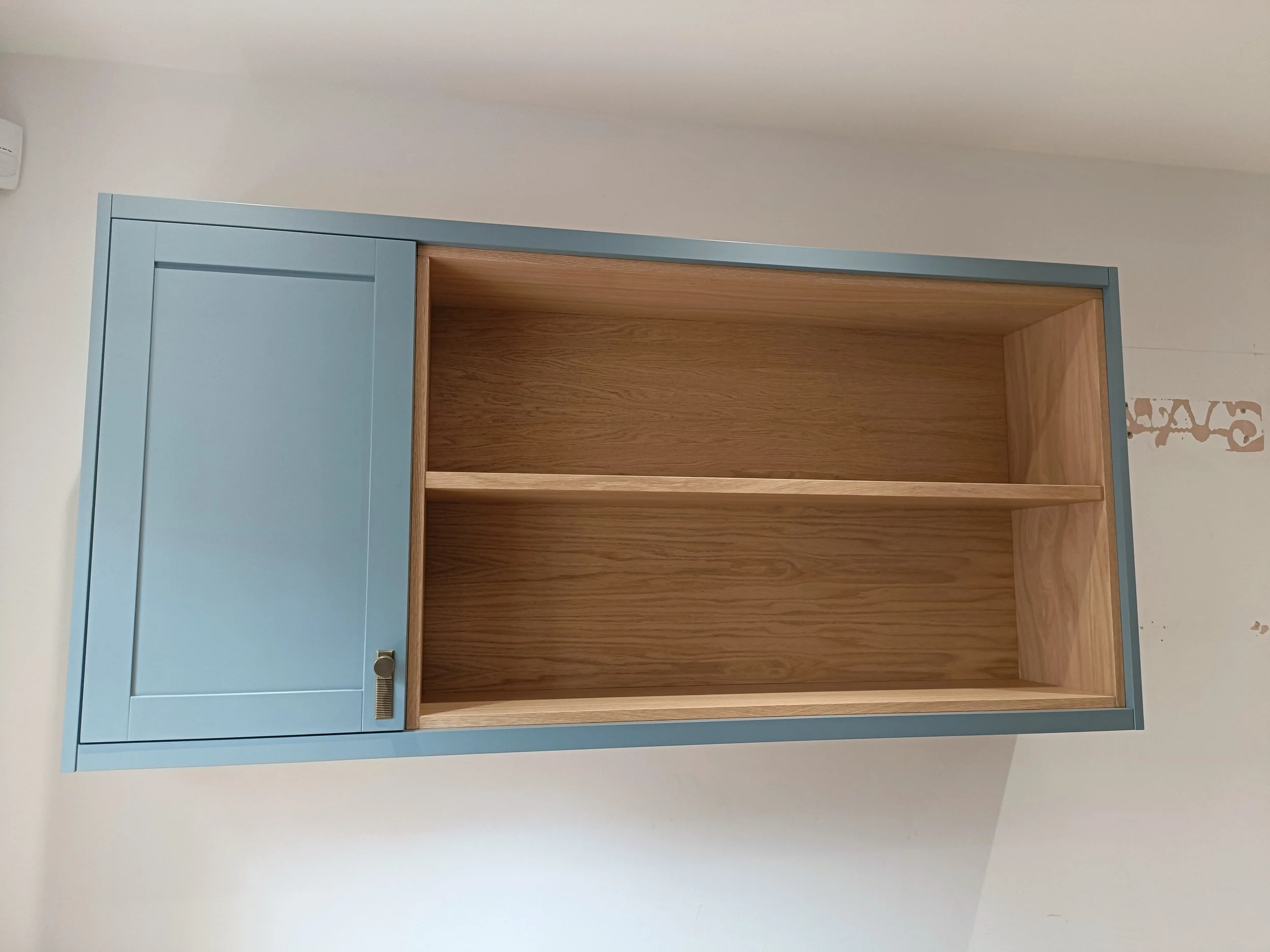 Office with desk space, open shelving and closed storage made bespoke, spray painted and installed in Ponteland.