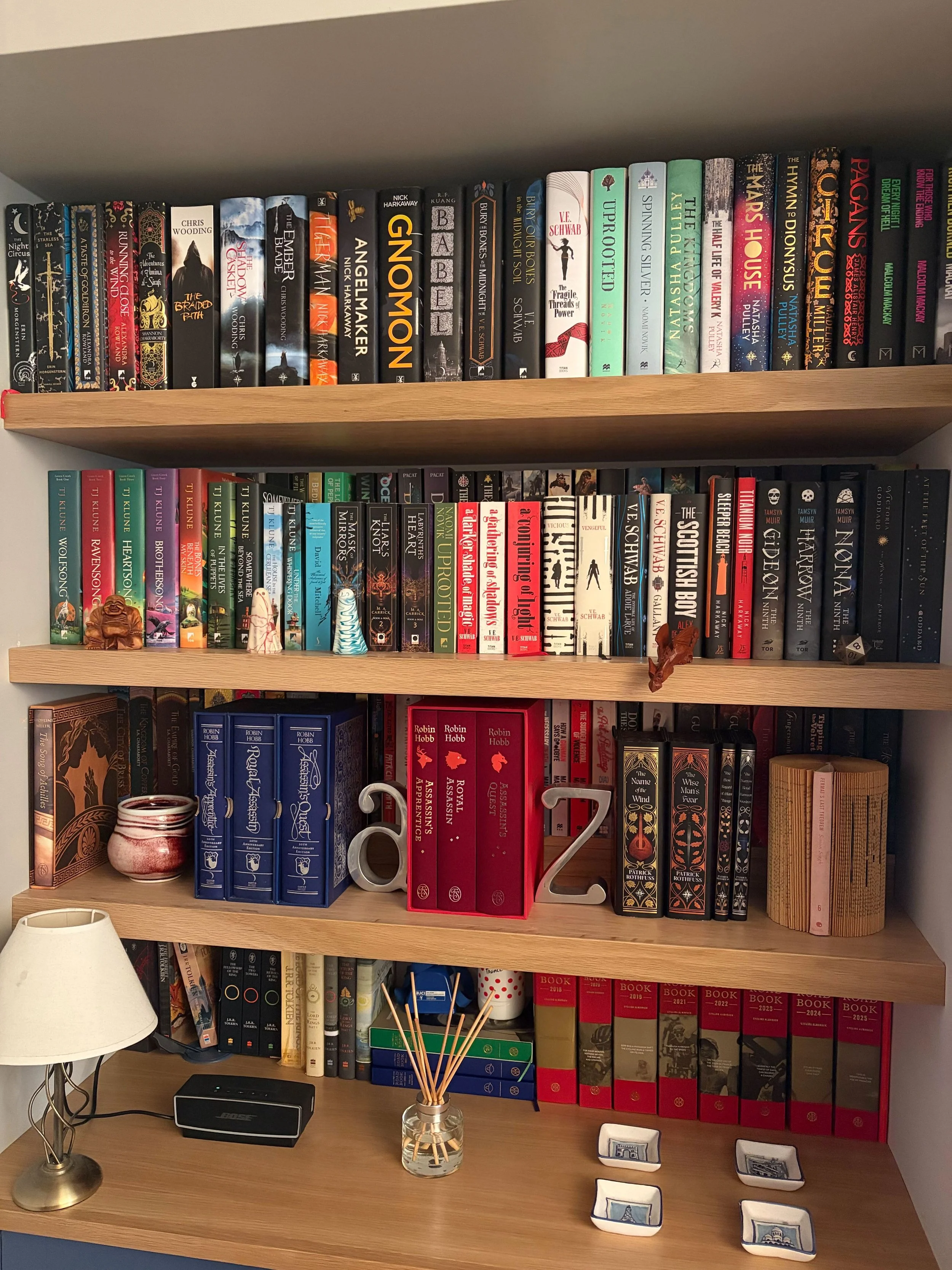 A bespoke installation in Gosforth in a mix of oak and painted finish, including extra deep bookshelves with removable 'lifts' at the back to allow display of a double layer of paperback books in a small space.