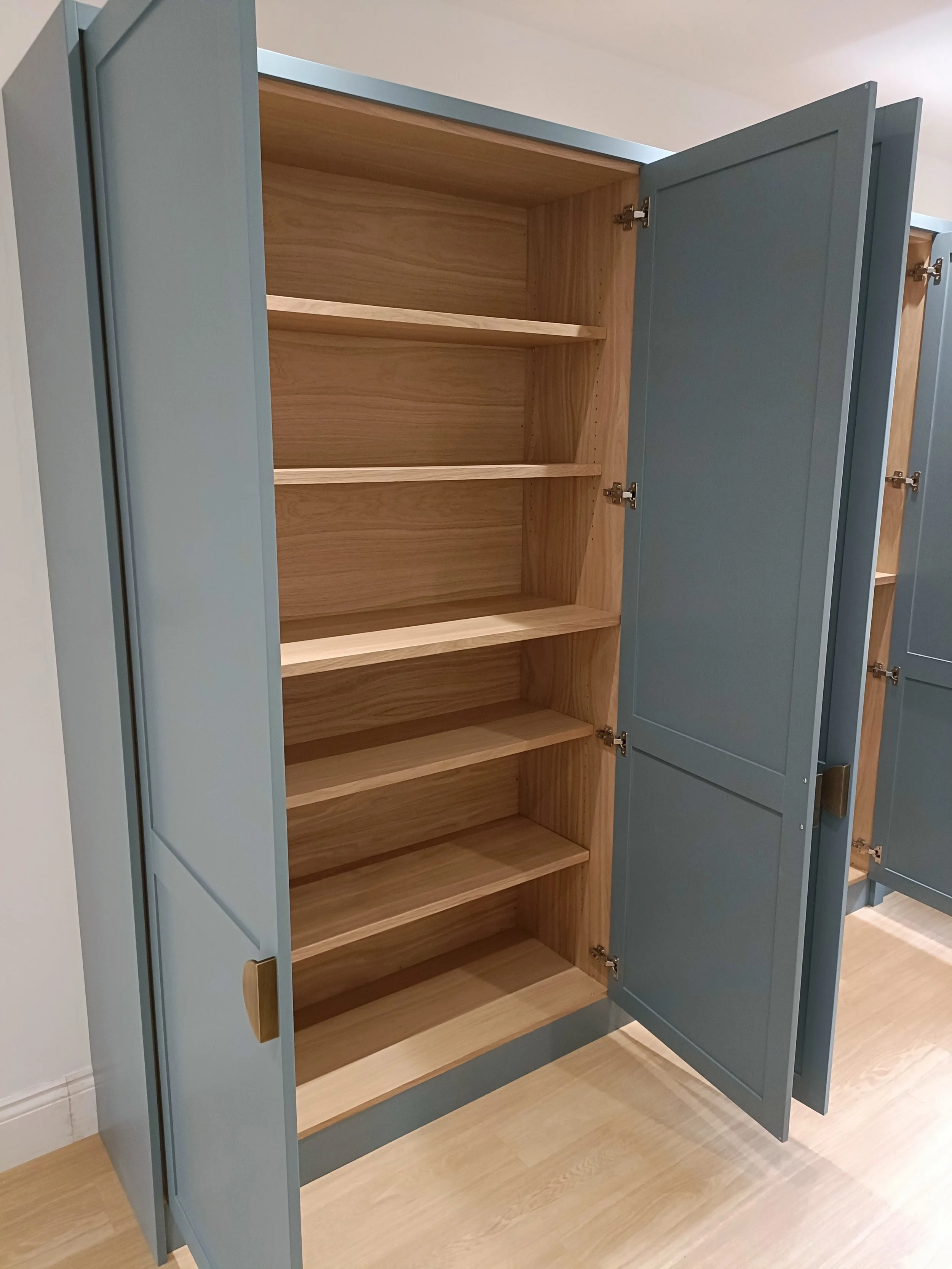 Office with desk space, open shelving and closed storage made bespoke, spray painted and installed in Ponteland.