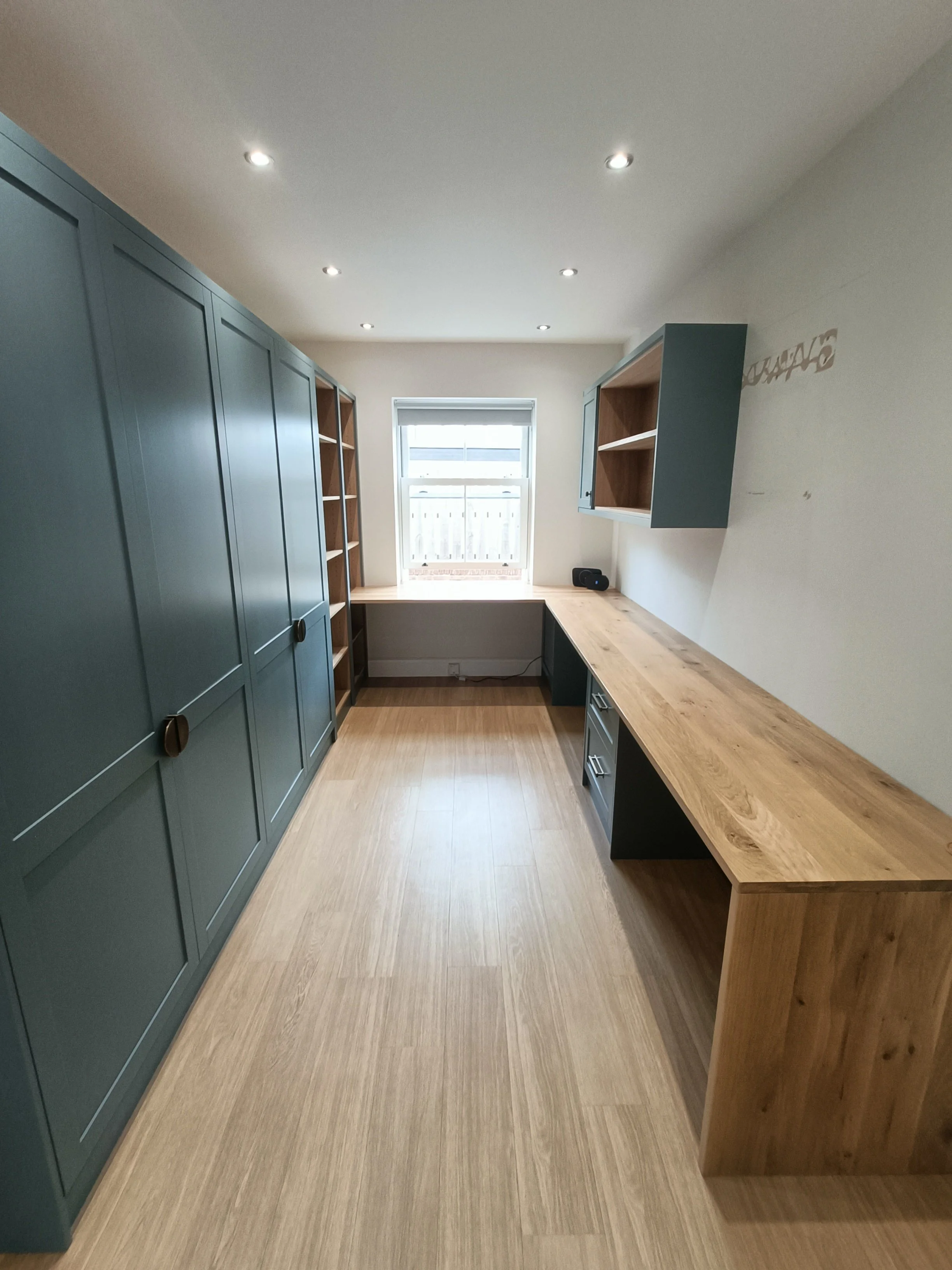 Office with desk space, open shelving and closed storage made bespoke, spray painted and installed in Ponteland.