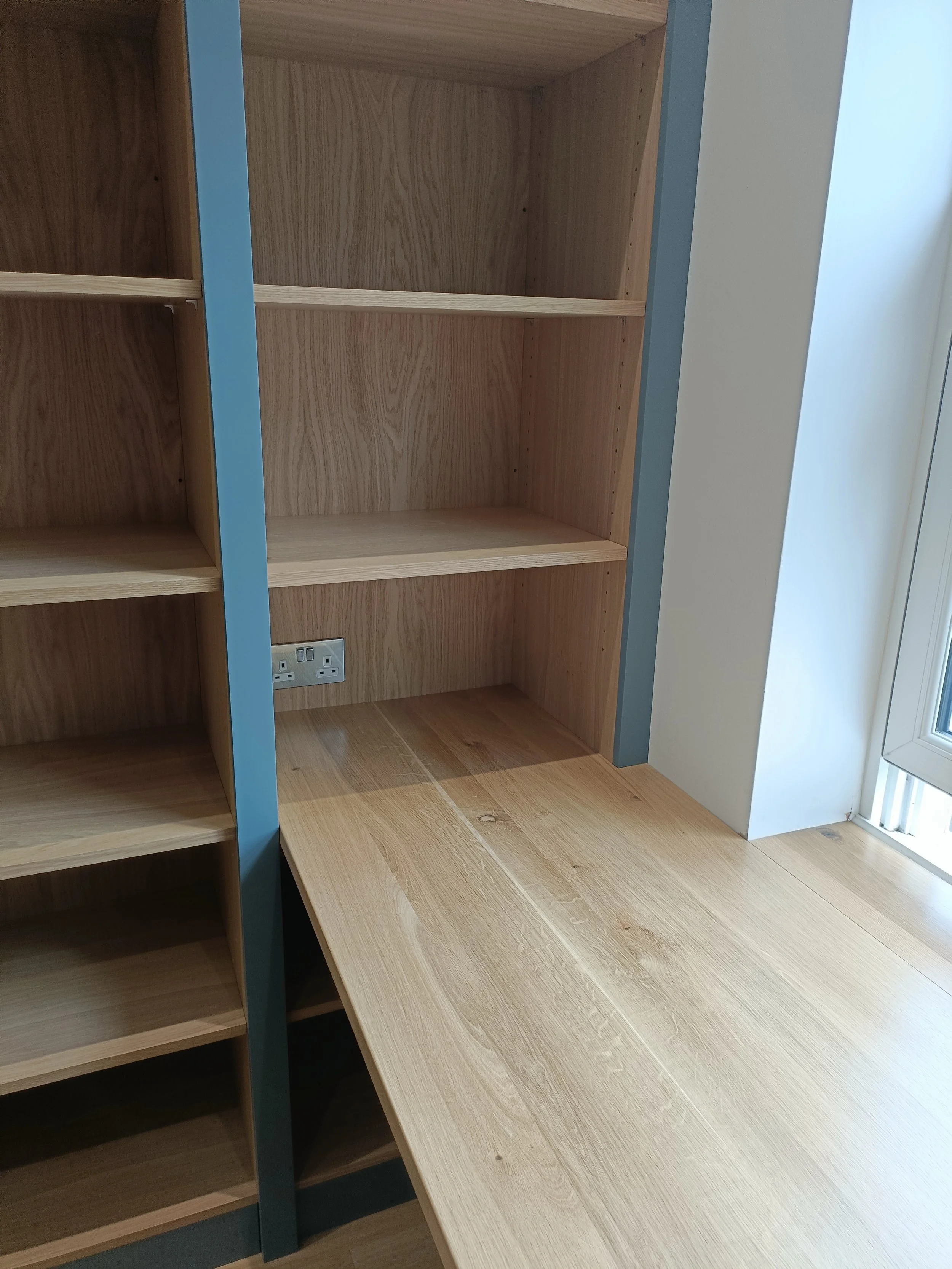 Office with desk space, open shelving and closed storage made bespoke, spray painted and installed in Ponteland.