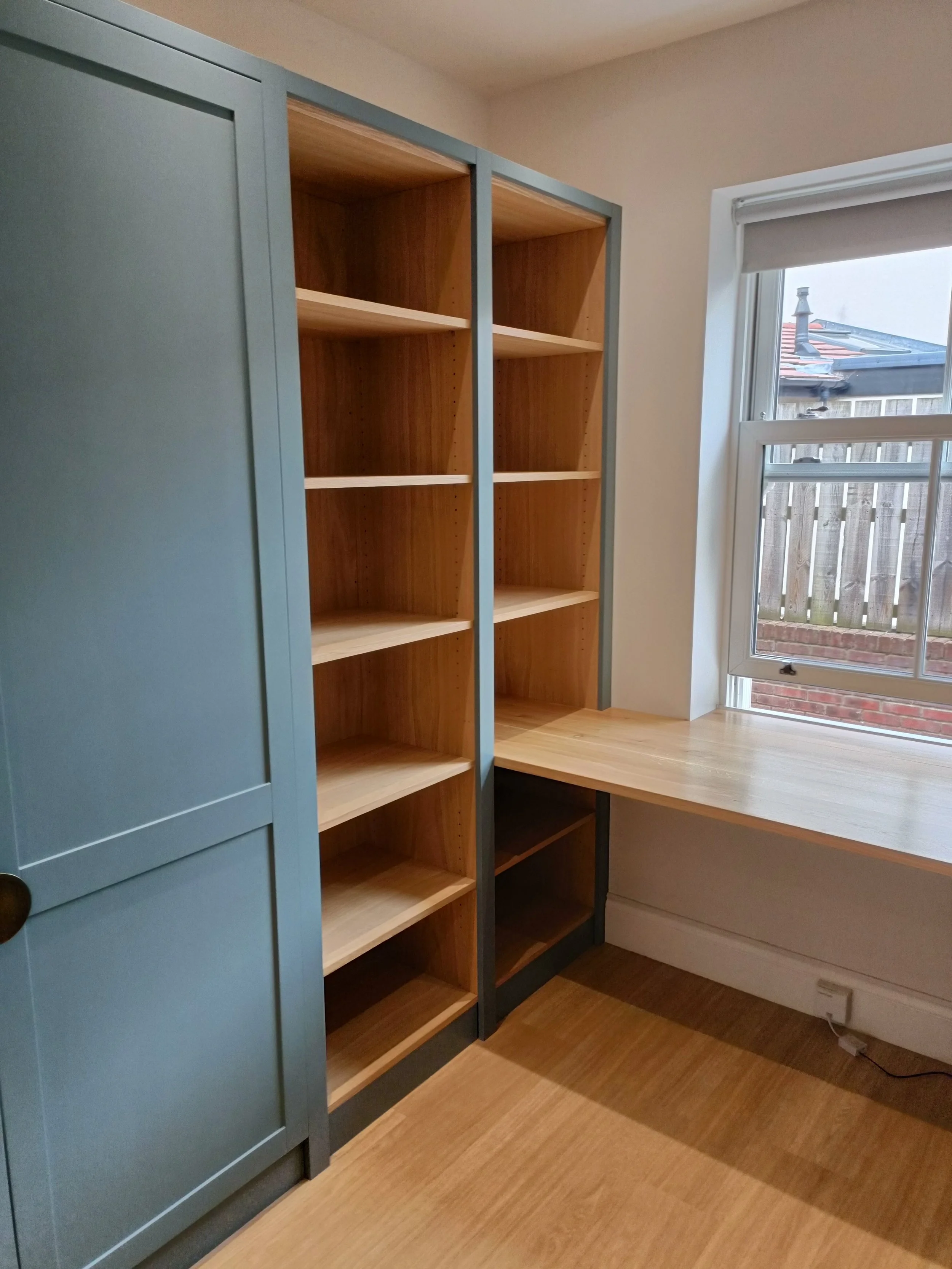 Office with desk space, open shelving and closed storage made bespoke, spray painted and installed in Ponteland.