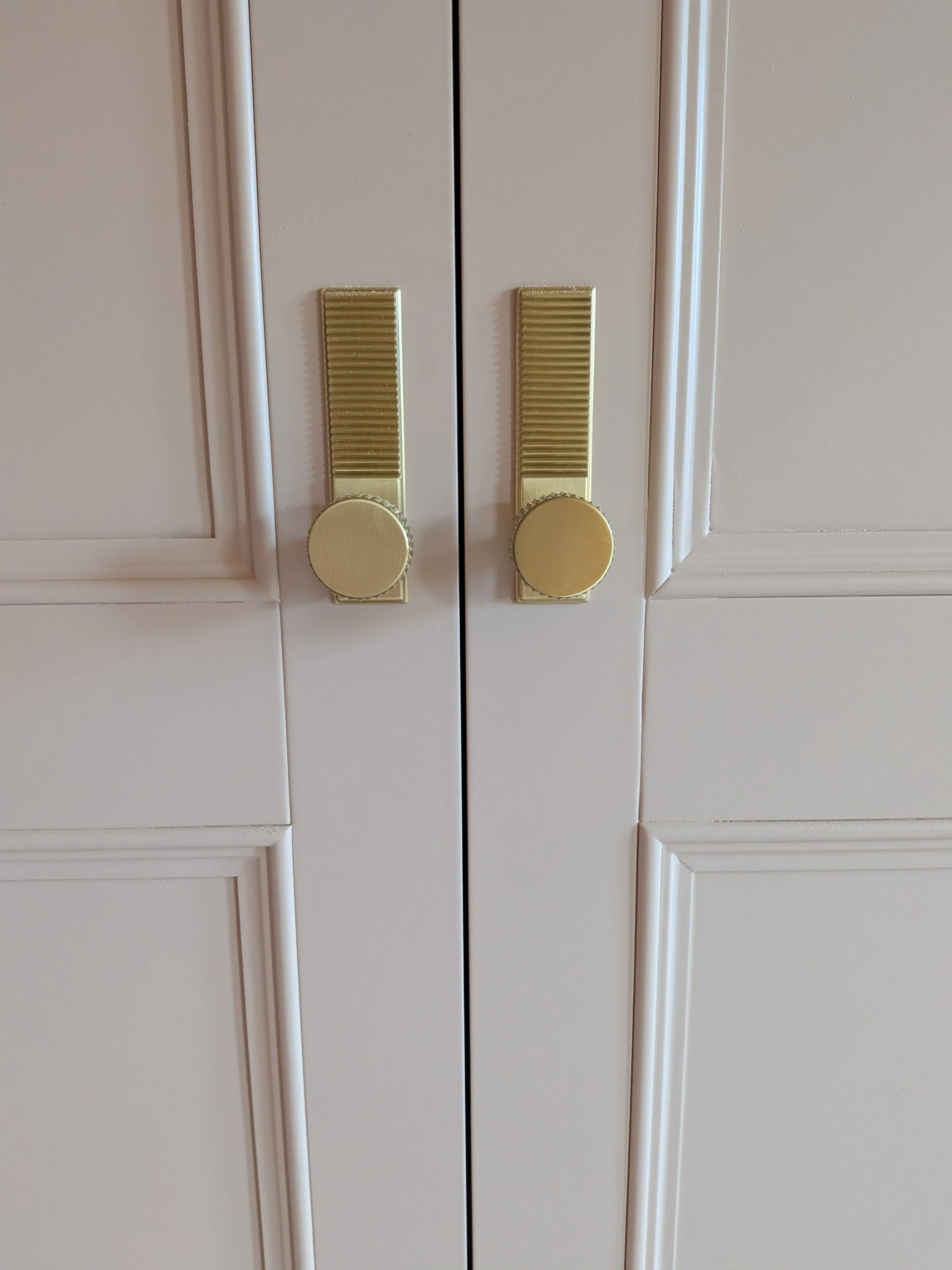 Large, luxury double wardrobes installed in Heaton with integrated lighting, internal shelving and drawers and high quality doorknobs.