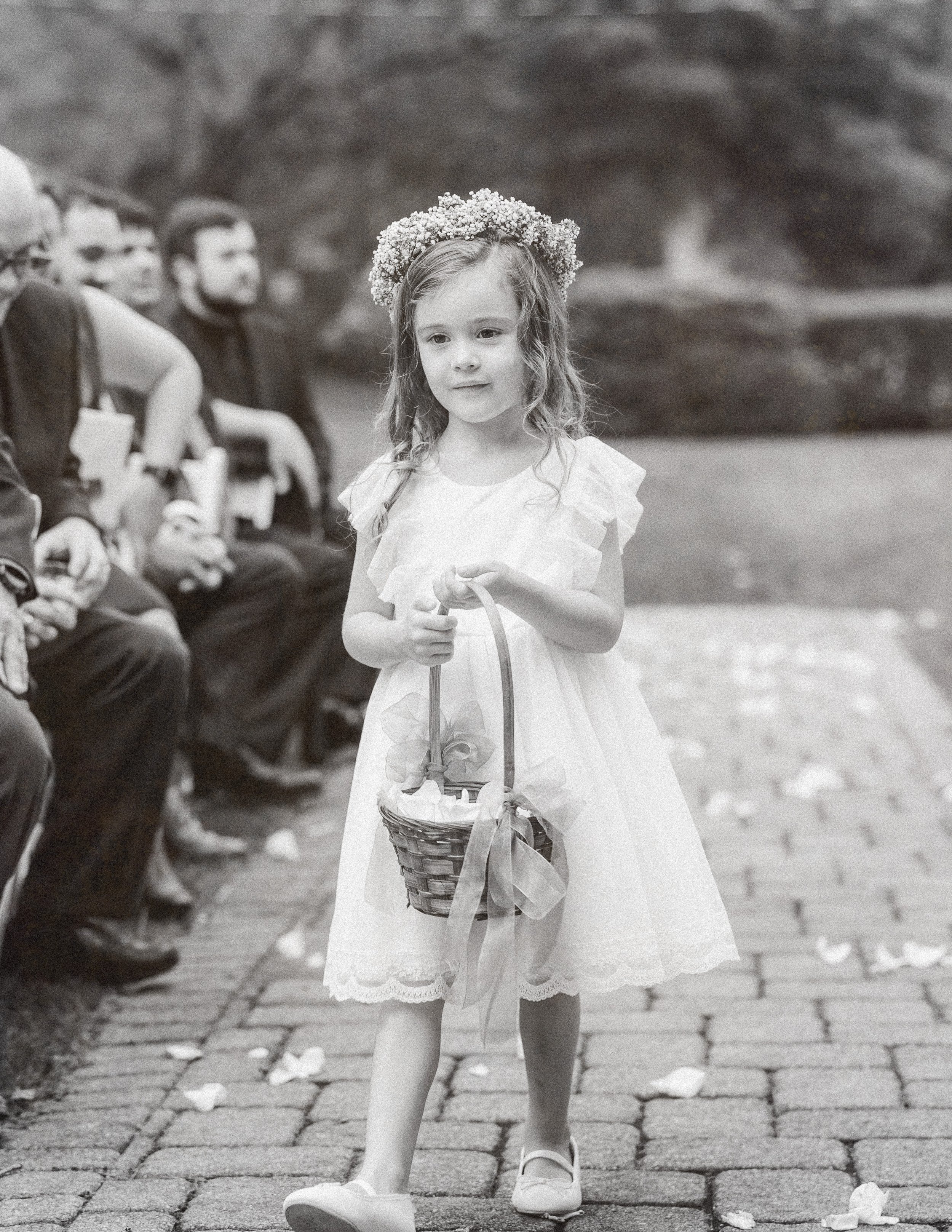 flower girl walking down the aisle at Mountainville Manor 