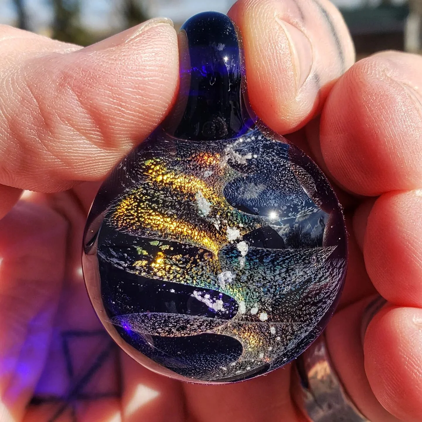 Spiraling daicroic and ash memorial pendant with a cobalt blue background. #boro #lampwork #memorialglass #memorialart #deathandart #mementomori