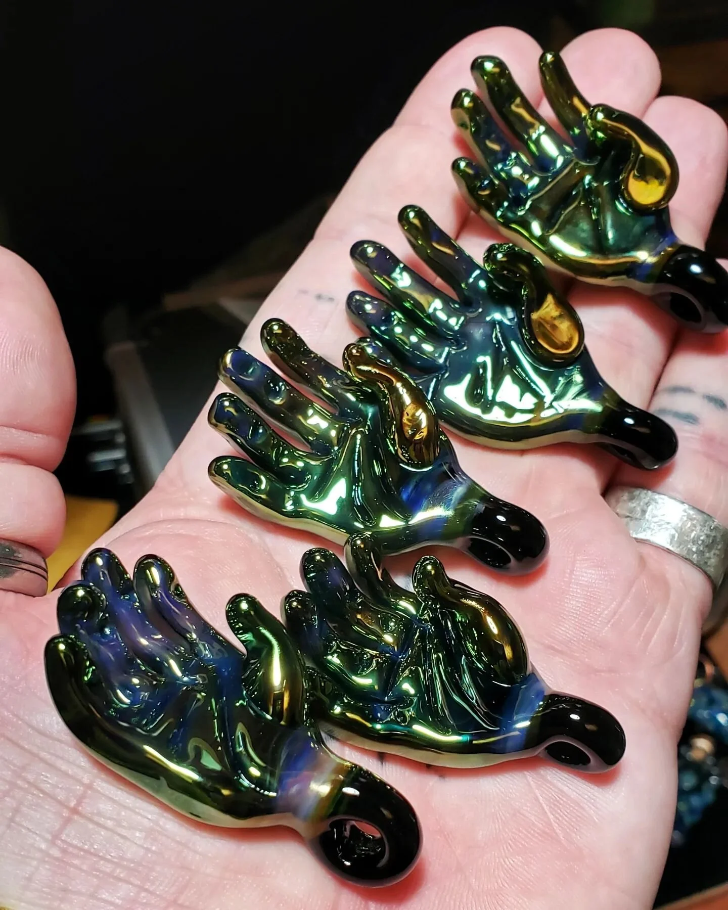 Sculpted glass hand pendant. Black glass coated with silver and gold fuming. These will be for sale too at the Local Con this weekend at @theaccelerateddragon_phoenix come by and check it out.  Sageglasscuriosities.com #boro #lampwork #witchy #glassj