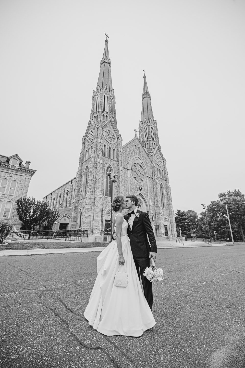 Bride and Groom Kiss outside St. Mary's Cathedral Peoria IL