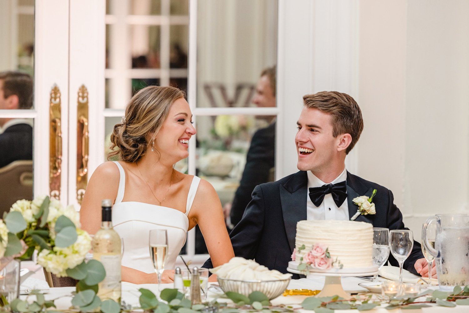 Bride and groom laugh at Pere Marquette Wedding Reception