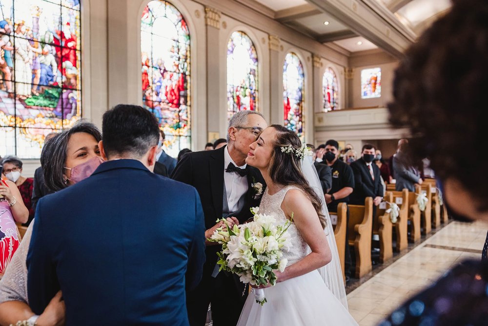 Father gives away bride at Catholic Wedding Ceremony