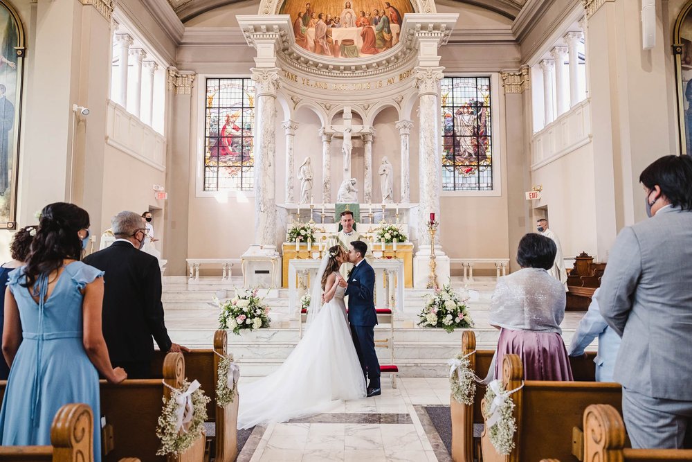 First Kiss at St. John's Catholic Newman Center Wedding