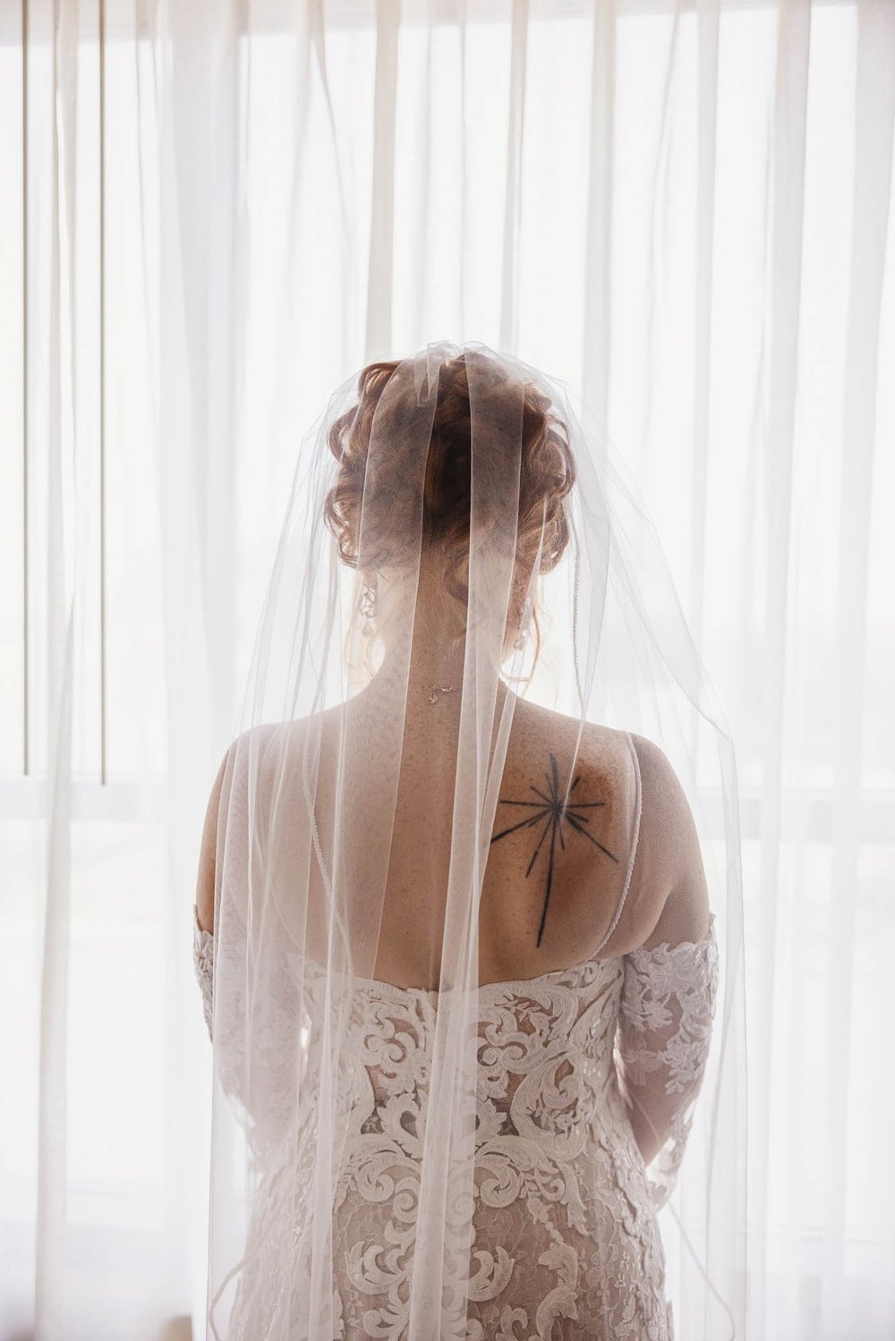 Bride with tattoo at Embassy Suites East Peoria