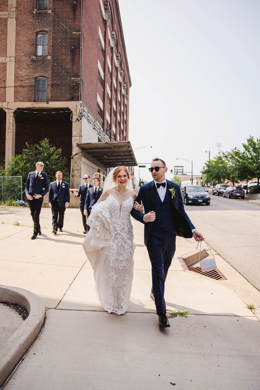 Bride and groom walk in Peoria Illinois Warehouse District