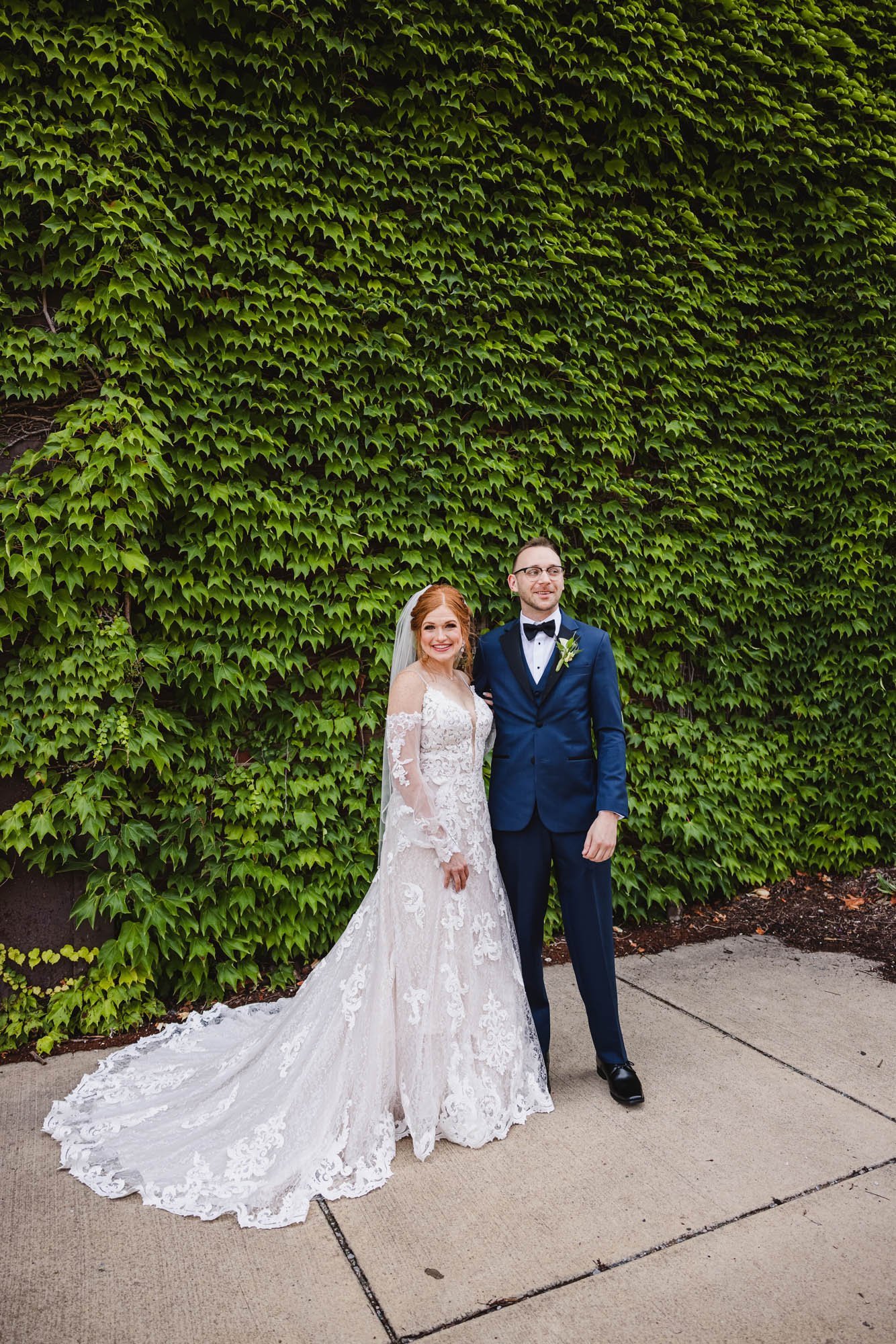 Bride and groom portrait in Peoria Illinois Warehouse District Ivy Wall