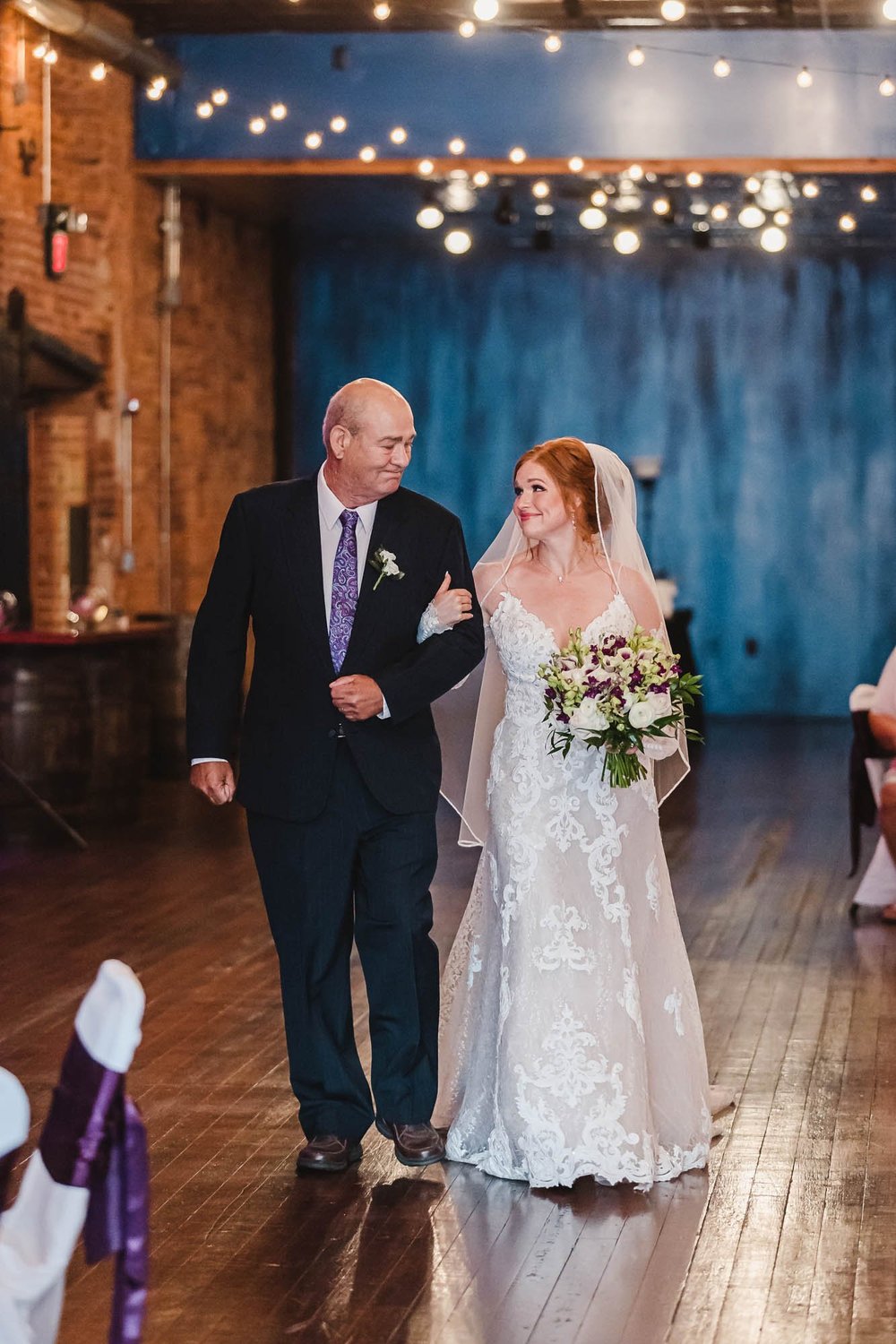 Bride and father walk down aisle at Waterhouse Distillery Room Wedding