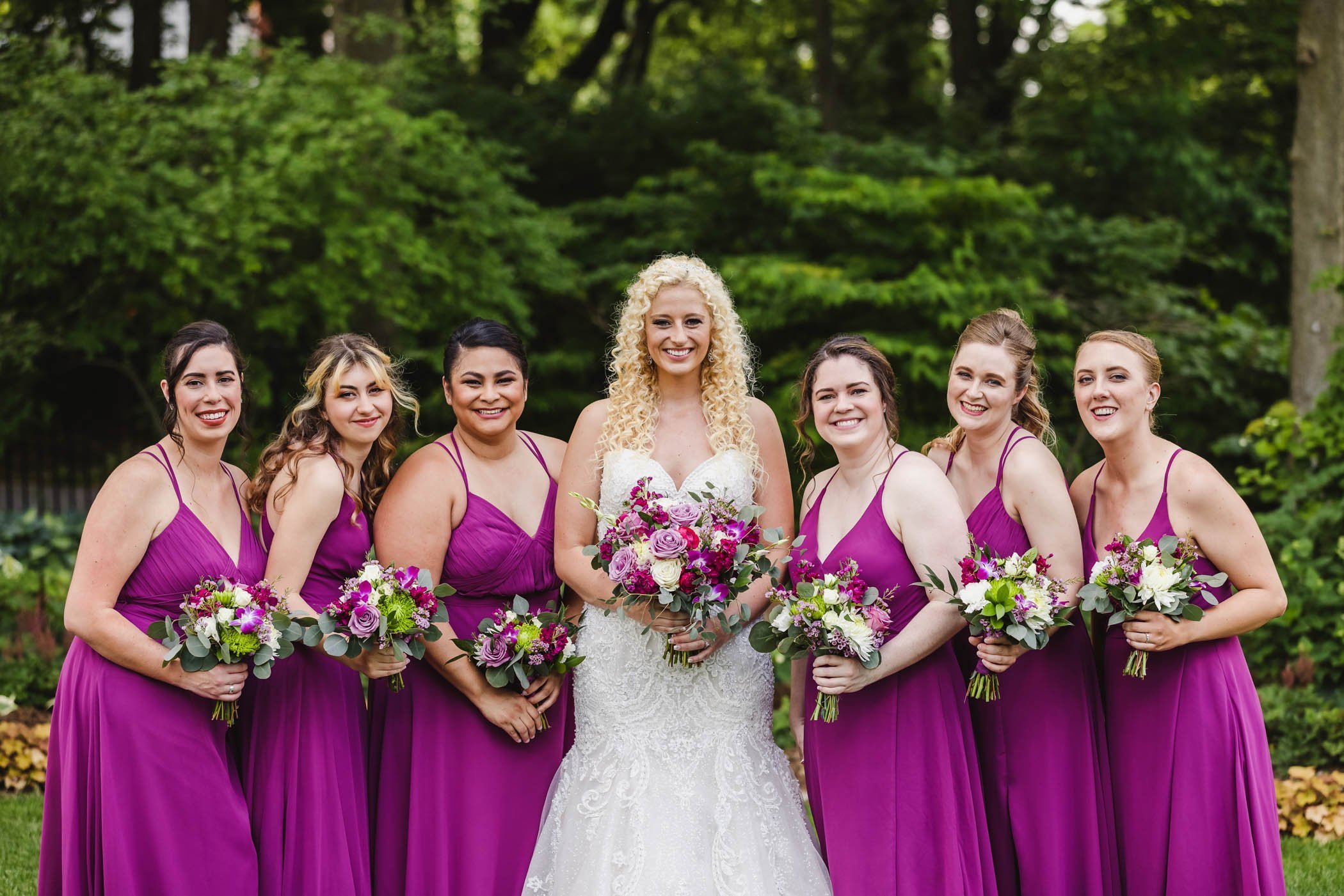 Bride and bridemaids with purple dresses