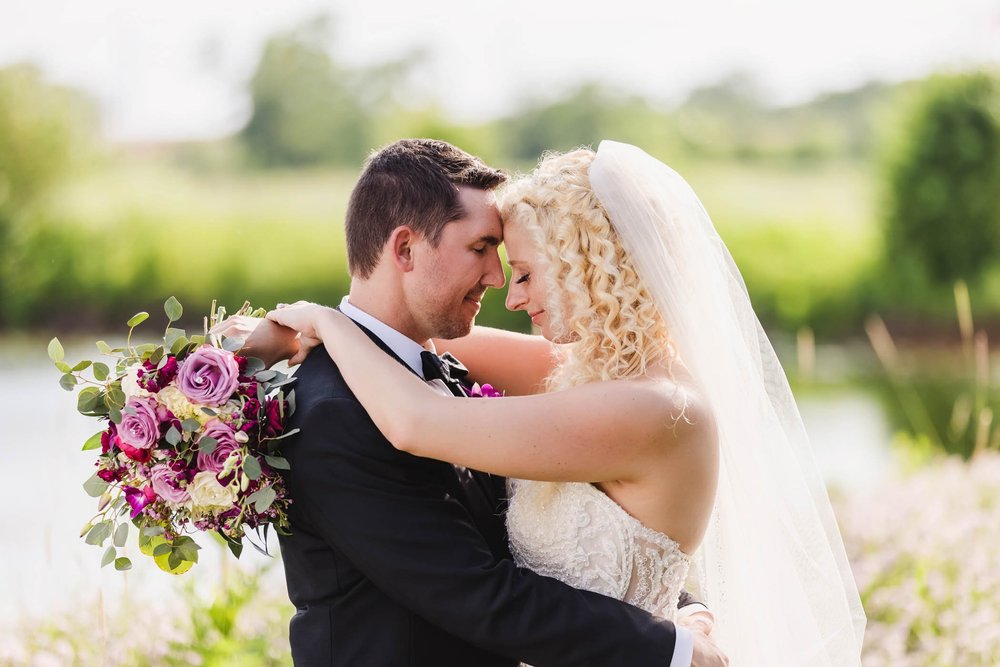 Bride and groom with water at Destihl Brewery