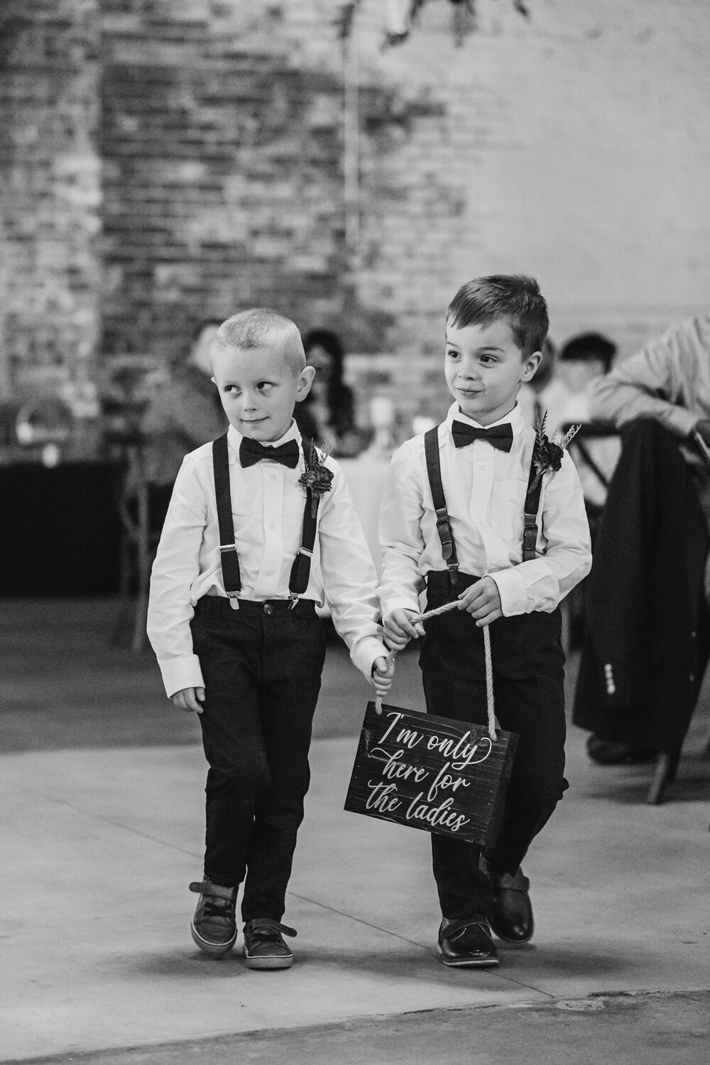 Ring Bearers holding sign here for the ladies