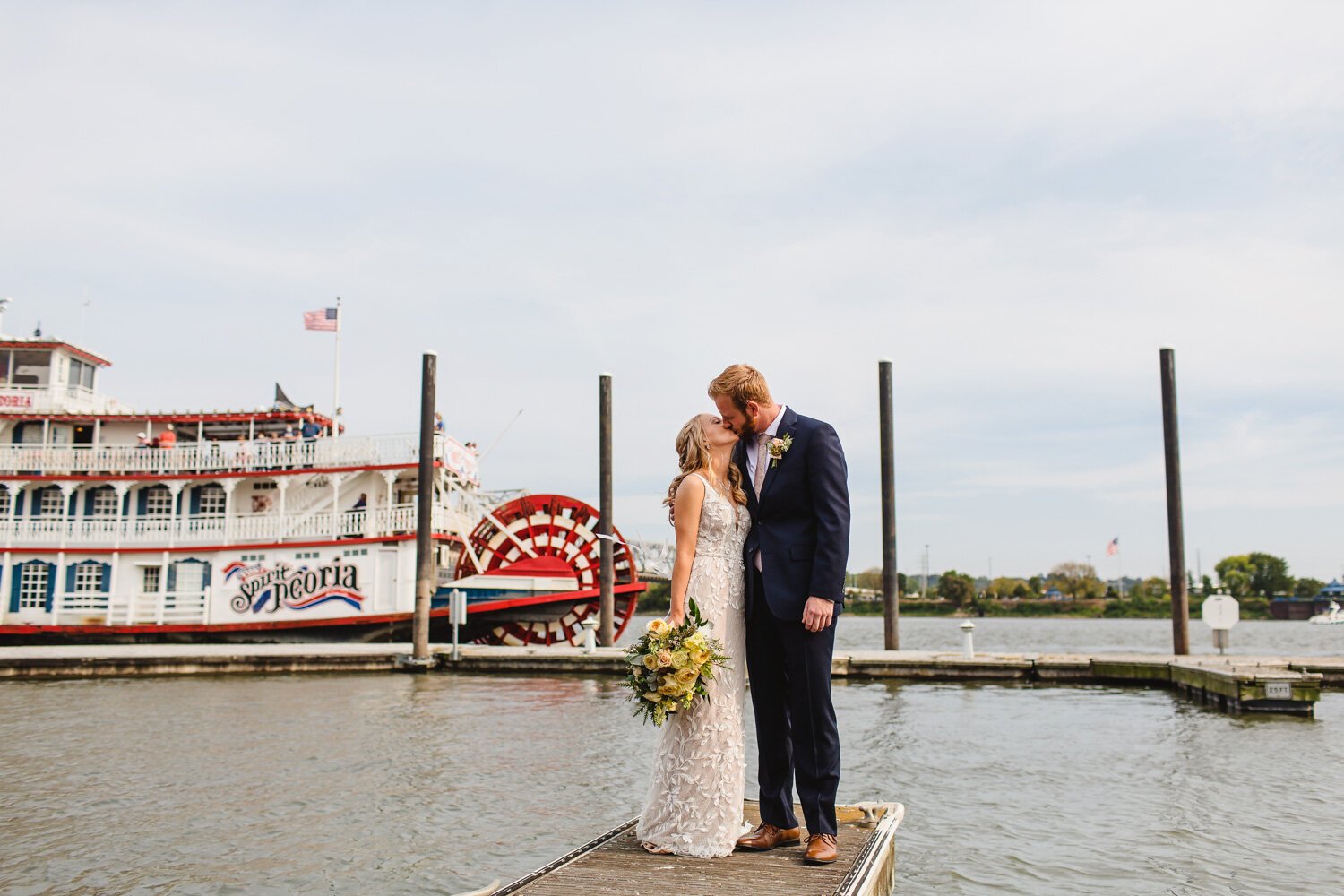 Bride and groom with Spirit of Peoria on Illinois River