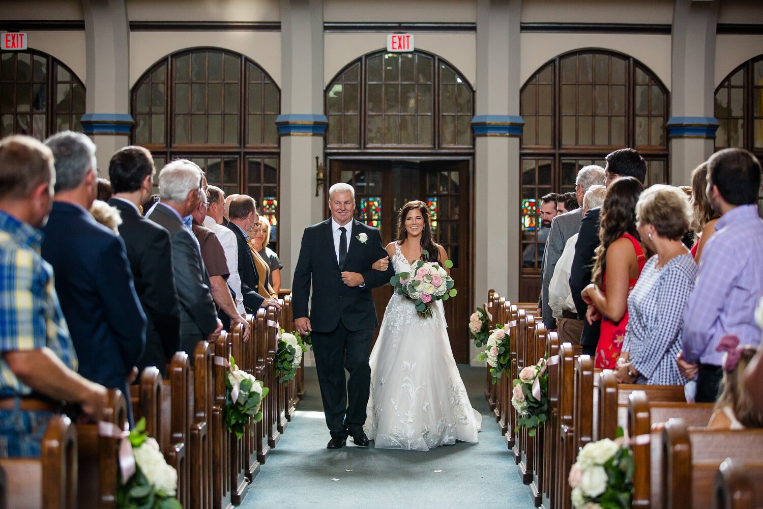 Bride walks down aisle at Sacred Heart Parish Wedding