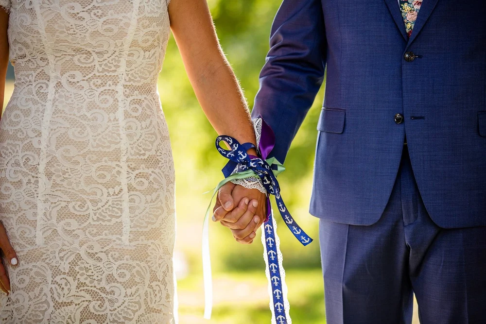 Hand fasting at wedding ceremony