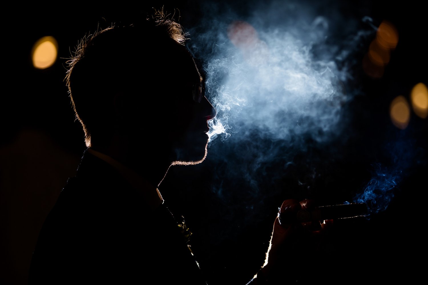 Groom smoking cigar silhouette