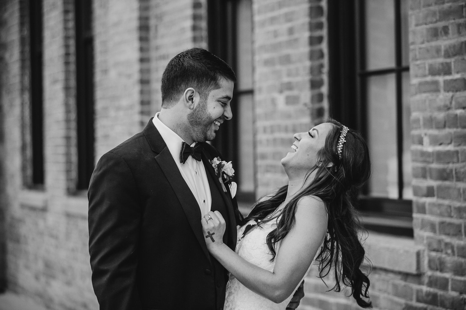 Bride and groom laugh together