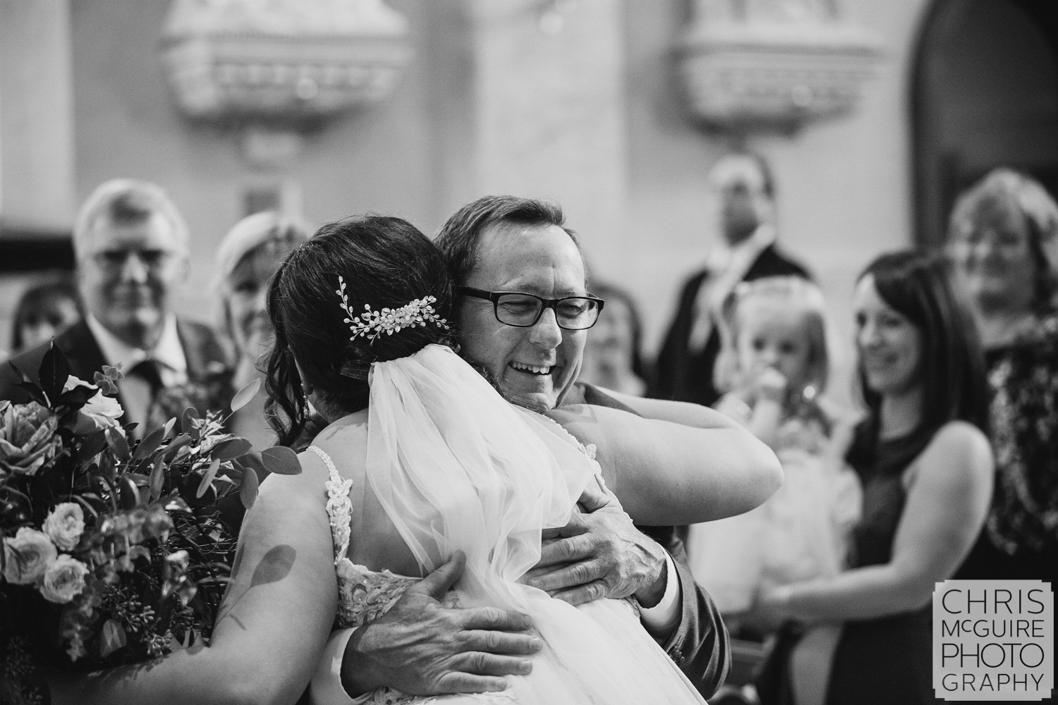 Bride hugs father at Peoria IL wedding