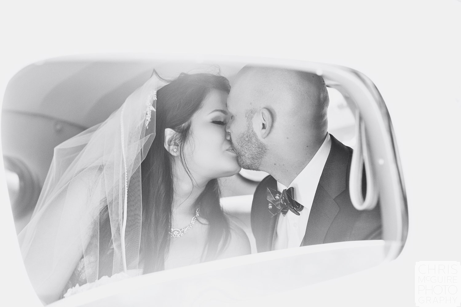 Central Illinois Wedding Photographer bride groom kiss in packard