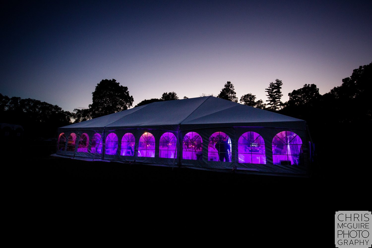 wedding reception tent at dusk