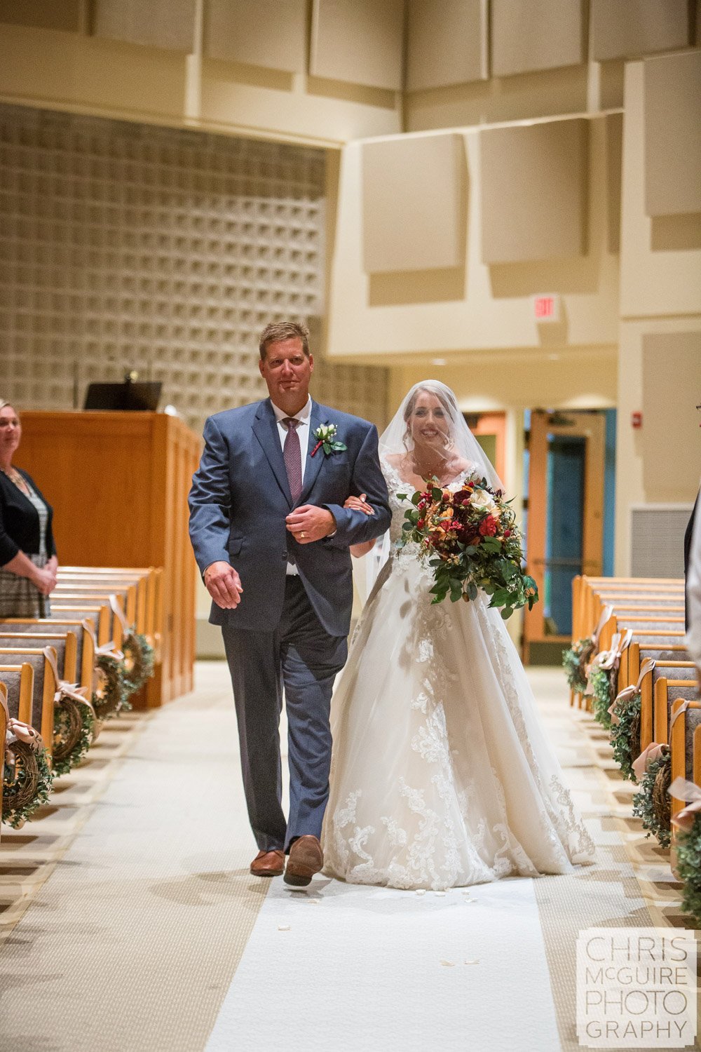 bride with father walking down aisle