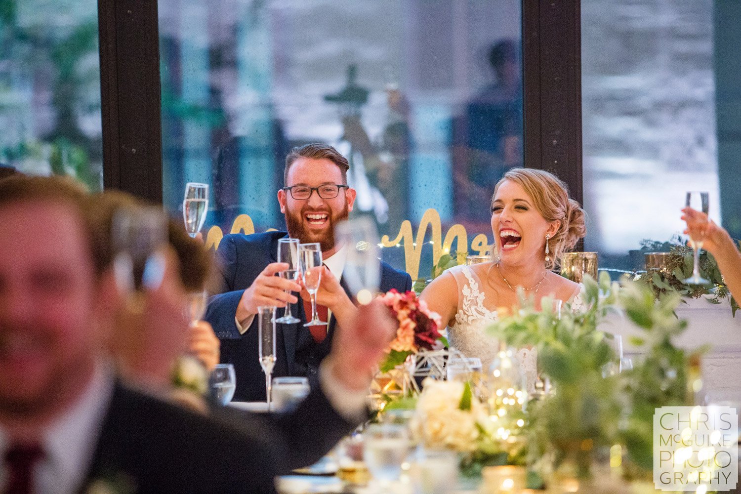 bride groom laugh during toast