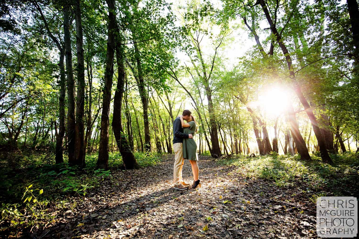 peoria il engagement portriat couple kissing in woods