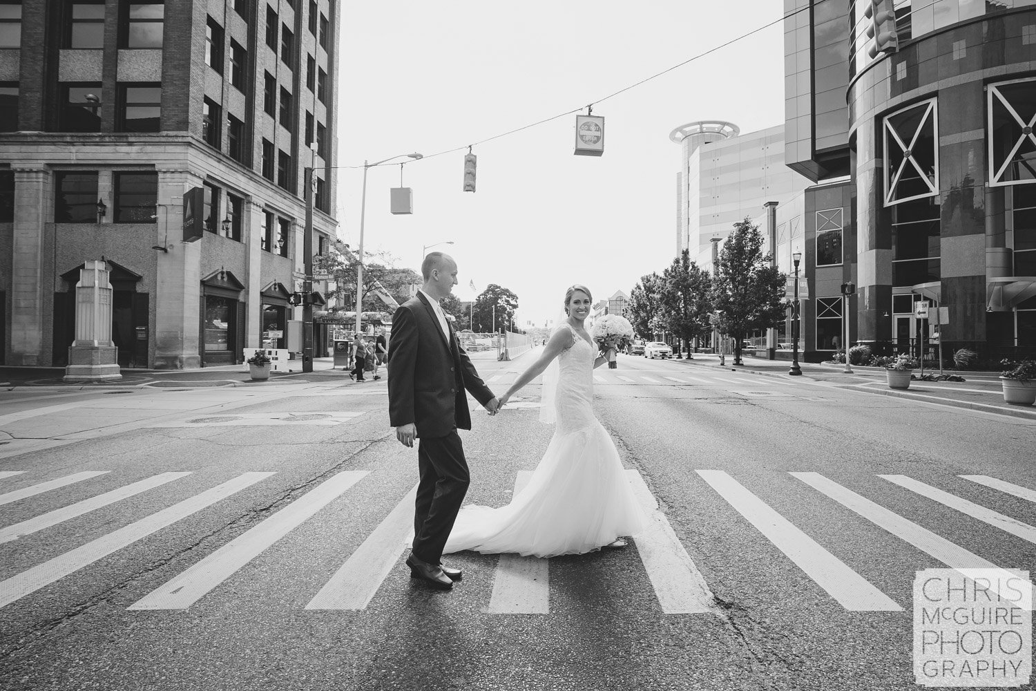 bride groom crossing street in downtown kalamazoo