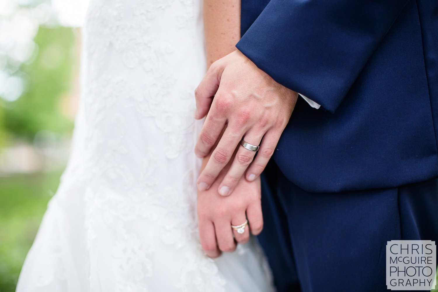 bride groom hands with wedding rings